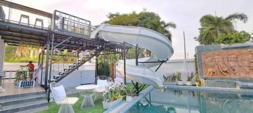 Modern backyard with swimming pool and waterslide