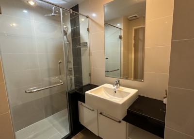 Modern bathroom with walk-in shower and stylish sink