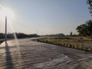 Spacious open land with potential for development under a clear sky at sunrise or sunset