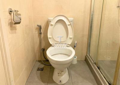 Clean and well-maintained bathroom interior with toilet and shower