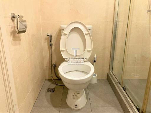 Clean and well-maintained bathroom interior with toilet and shower