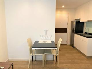 Modern kitchen with dining area and wooden floor