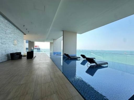 Luxury indoor swimming pool with ocean view