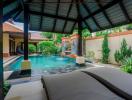 Luxurious private pool surrounded by lush garden and comfortable patio area
