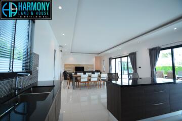 Modern spacious kitchen with dining area and ample lighting