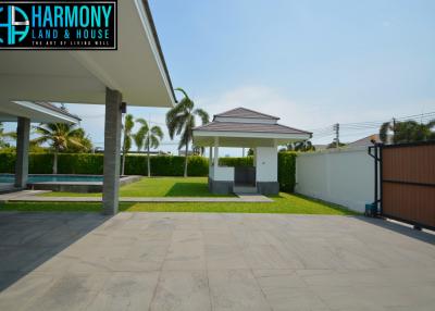 Spacious outdoor area with swimming pool and gazebo