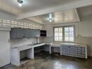 Spacious unfurnished kitchen with natural light