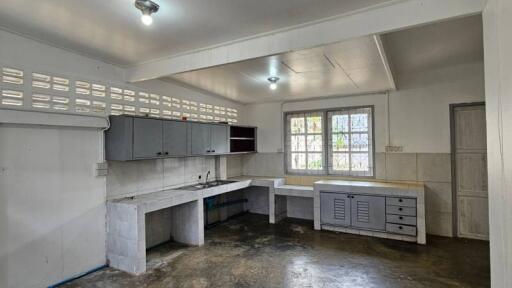 Spacious unfurnished kitchen with natural light