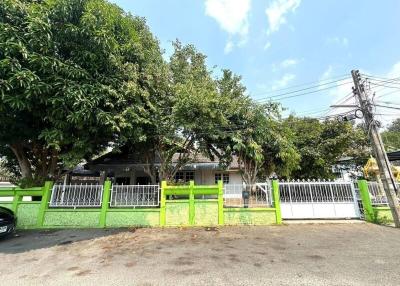 Exterior view of a residential home with a fenced yard