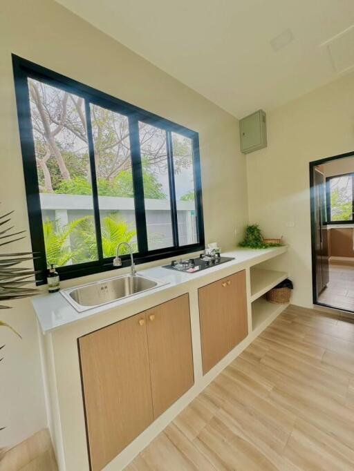 Modern kitchen with large windows and ample natural light