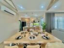 Modern open concept living space with dining area and view into the kitchen
