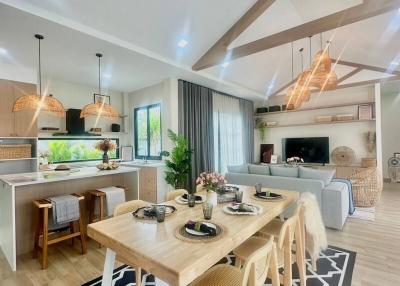 Modern open plan living space with dining area and kitchen