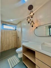 Modern bathroom interior with elegant lighting and wooden finishes