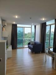 Modern living room with natural light and balcony access