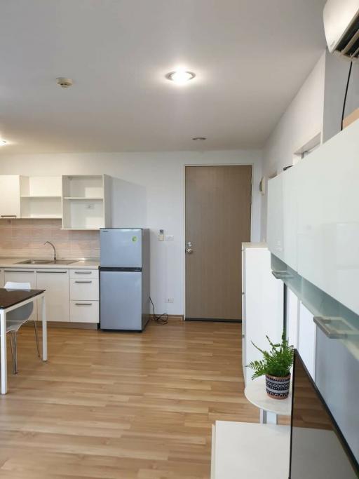 Compact modern kitchen with open layout adjacent to the living area