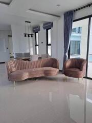 Modern living room with elegant furniture and polished flooring