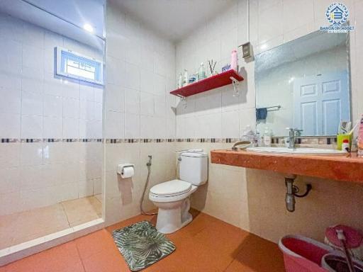 Compact bathroom with toilet and sink