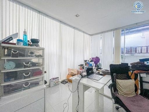 Modern home office space with a desk and shelving unit