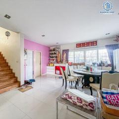 Spacious living room with dining area and staircase