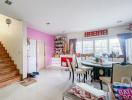 Spacious living room with dining area and staircase