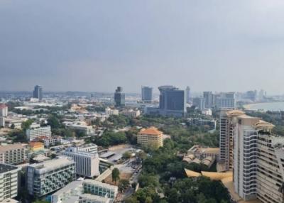 Aerial view of a dense urban skyline showcasing a mix of residential and commercial buildings