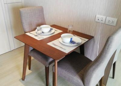 Cozy dining space with a wooden table and two chairs