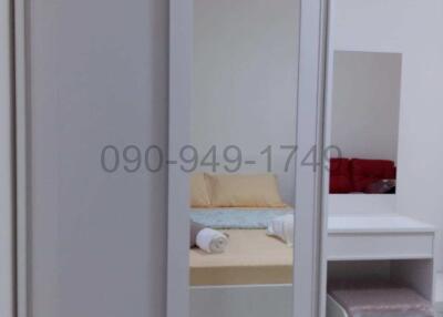 Modern bedroom with sliding wardrobe and side table