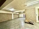 Spacious indoor garage with tiled flooring and bright lighting