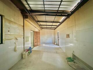 Spacious unfurnished interior space with partially open roof