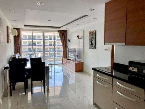 Modern living room with dining area and kitchenette