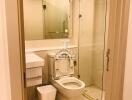 Modern bathroom interior with glass shower and mirror