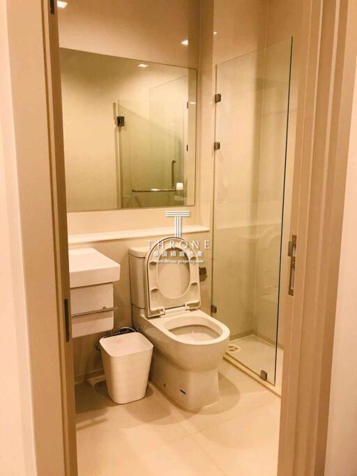 Modern bathroom interior with glass shower and mirror