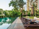 Residential complex with outdoor swimming pool and lounge chairs