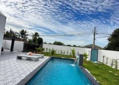 Swimming pool with beautiful clouds in the sky
