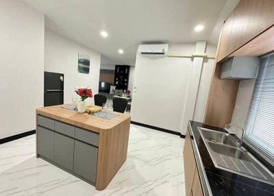 Modern kitchen with island and stainless steel appliances