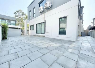 Modern building exterior with spacious paved forecourt