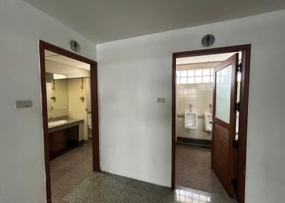 Interior view of a building showing the entrance to a bathroom