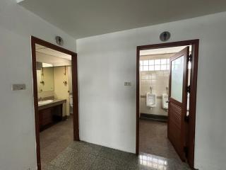 Interior view of a building showing the entrance to a bathroom