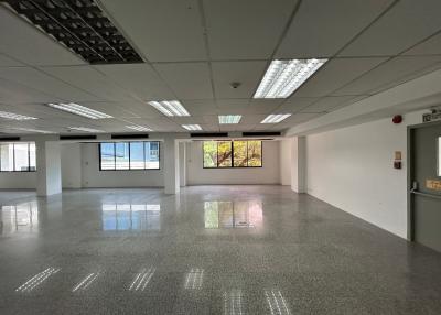 Spacious commercial office space with large windows and ample lighting