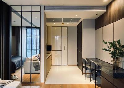 Modern open-concept apartment with integrated living, kitchen, and sleep areas