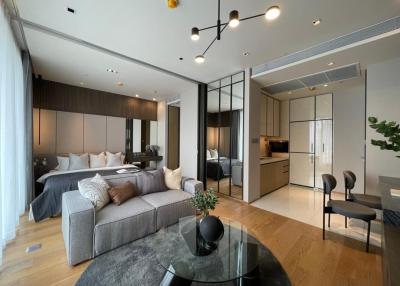 Modern open-plan living space with combined living room and bedroom area