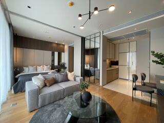 Modern open-plan living space with combined living room and bedroom area