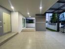 Modern home entrance with tiled flooring and recessed lighting