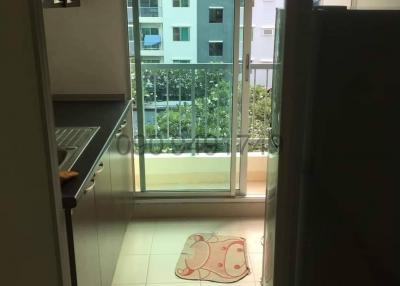 Compact balcony with a view of neighboring buildings