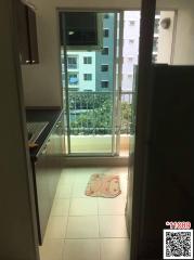 Compact balcony with a view of neighboring buildings