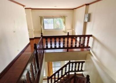 Bright interior view showcasing the staircase and upper landing area of a home