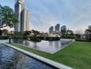 Luxurious residential building with outdoor koi pond and skyline view