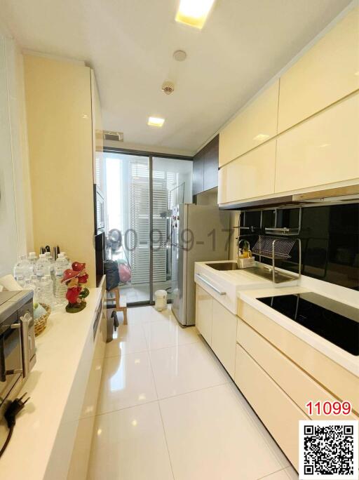 Modern kitchen with white cabinets and built-in appliances