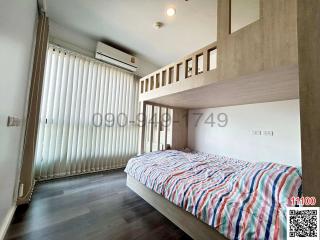 Modern bedroom with large bed and natural light