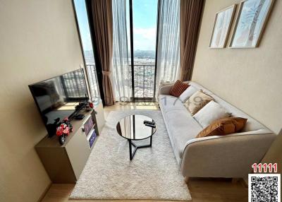 Cozy living room with natural light and city view